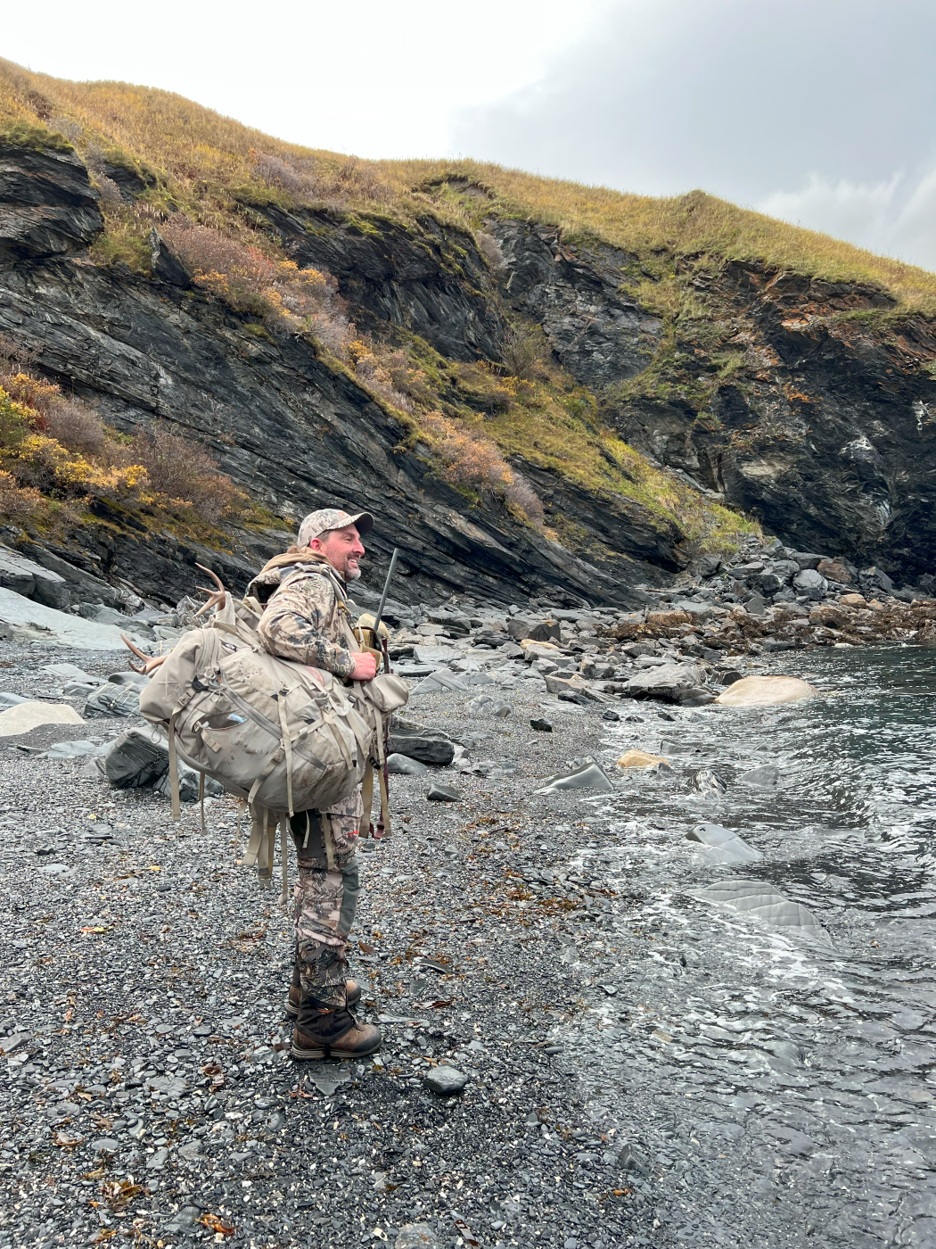 Skipp standing at the edge of the water.