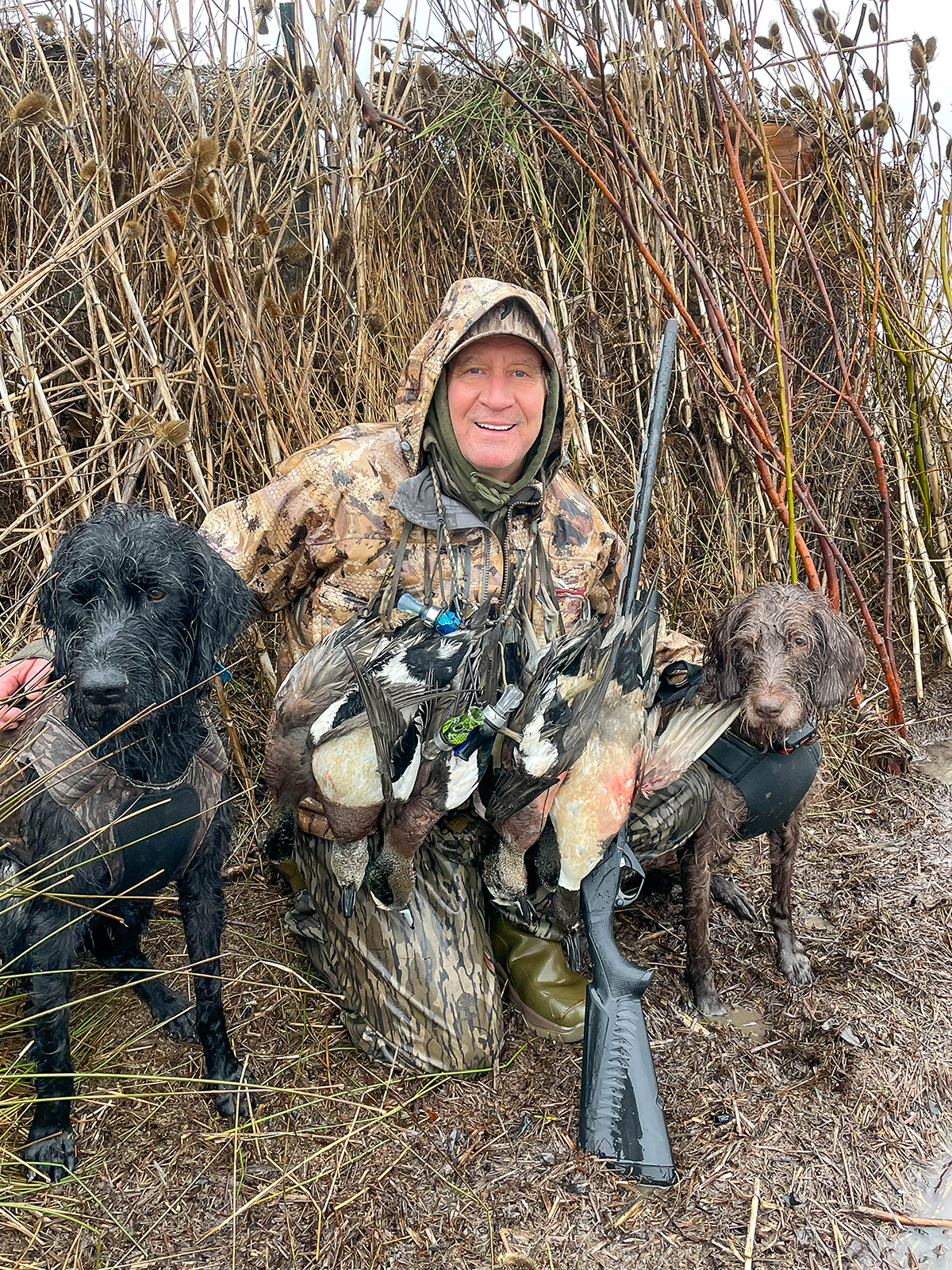 Scott Haugen and Dog Kona with Duck and SBE3 20ga.