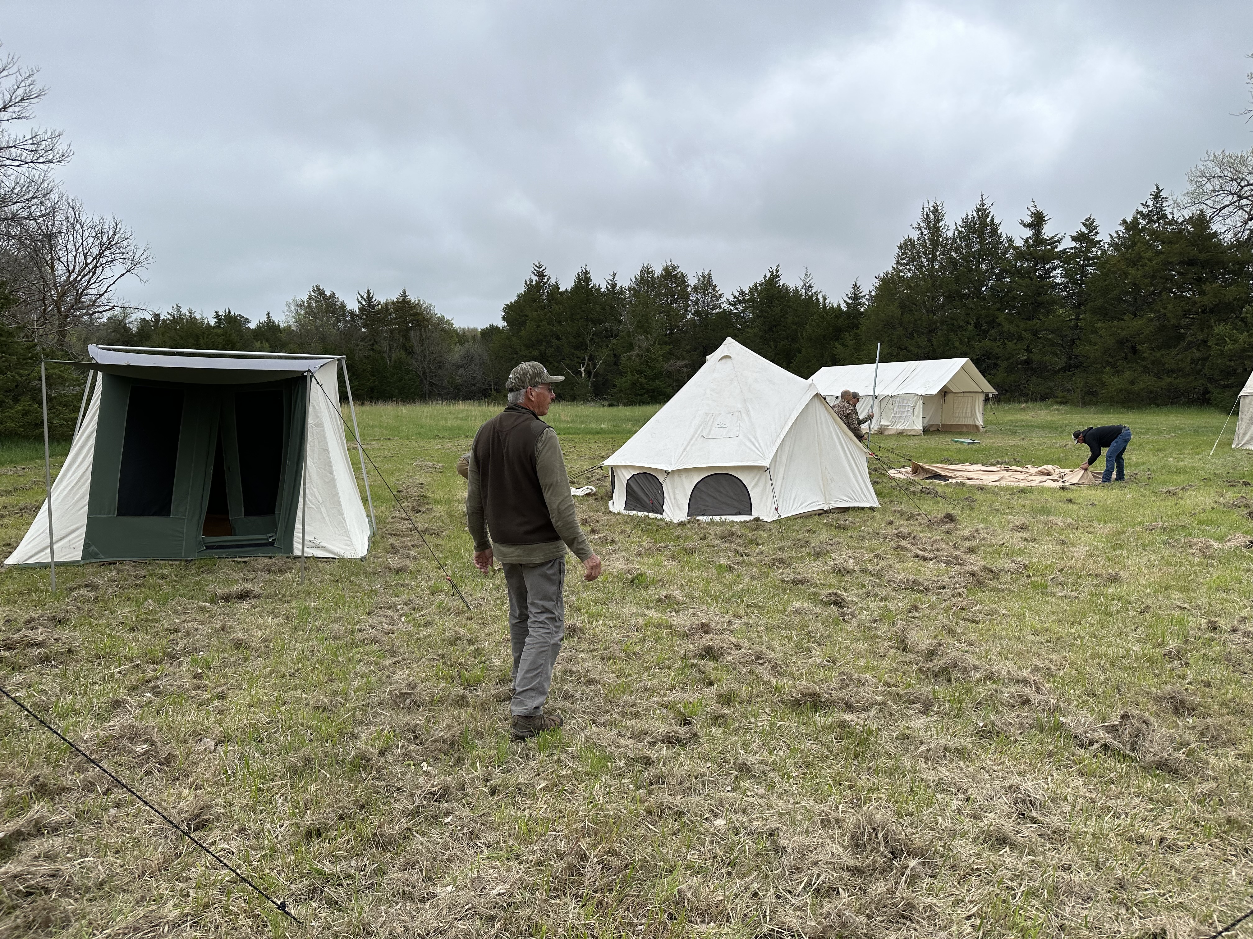 Camp tents up with cots inside 