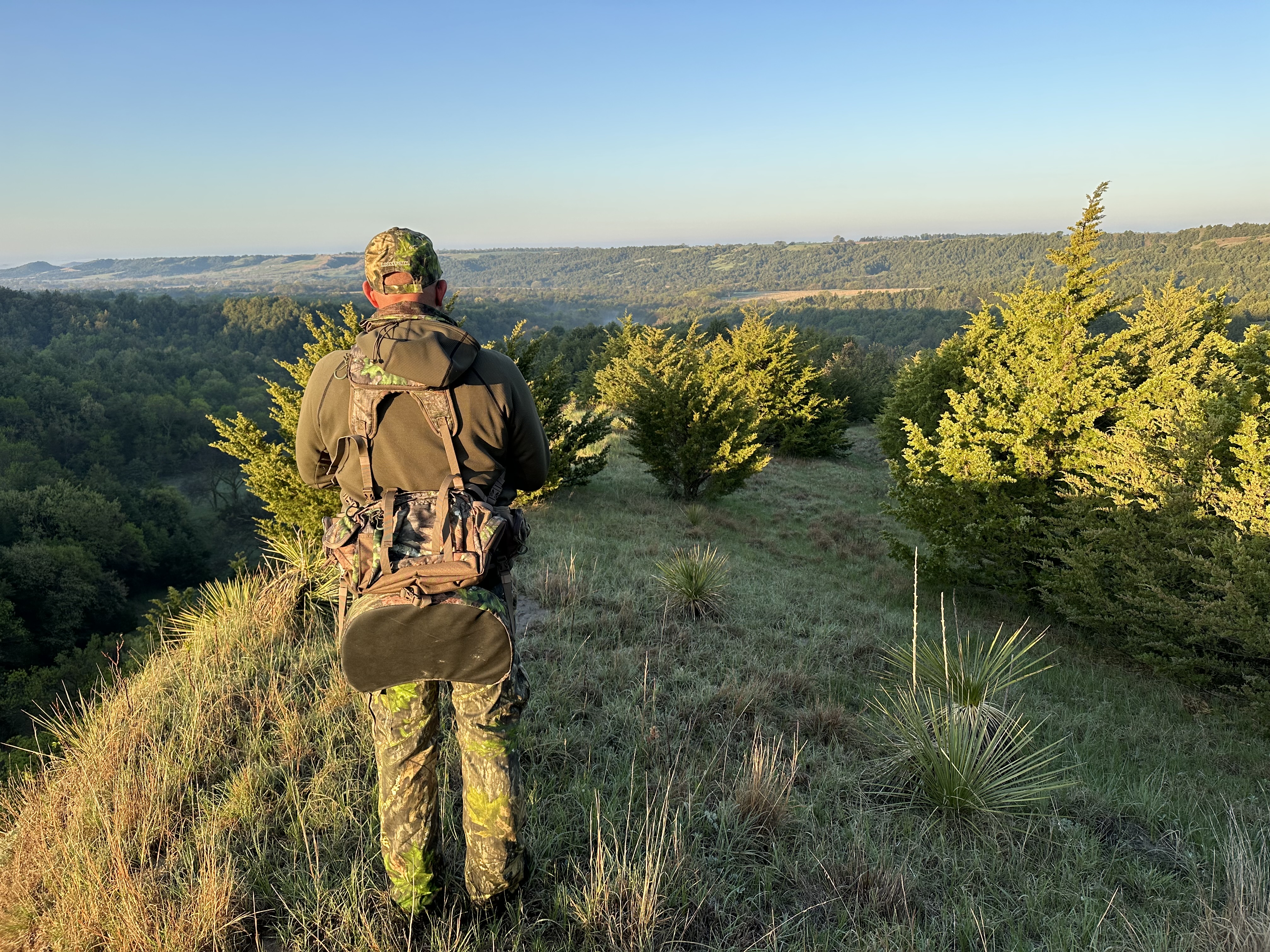 Man looking for Turkeys in a mountian scape