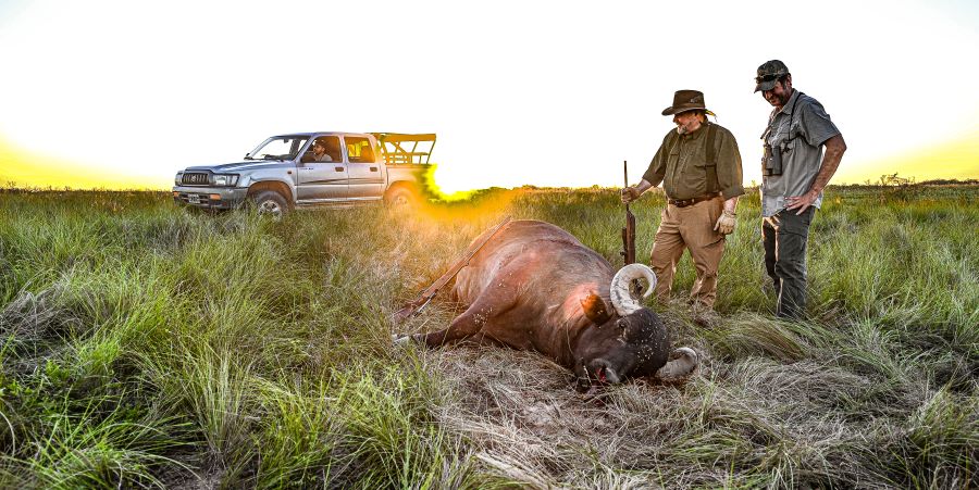 Tim and guide with  downed buffalo
