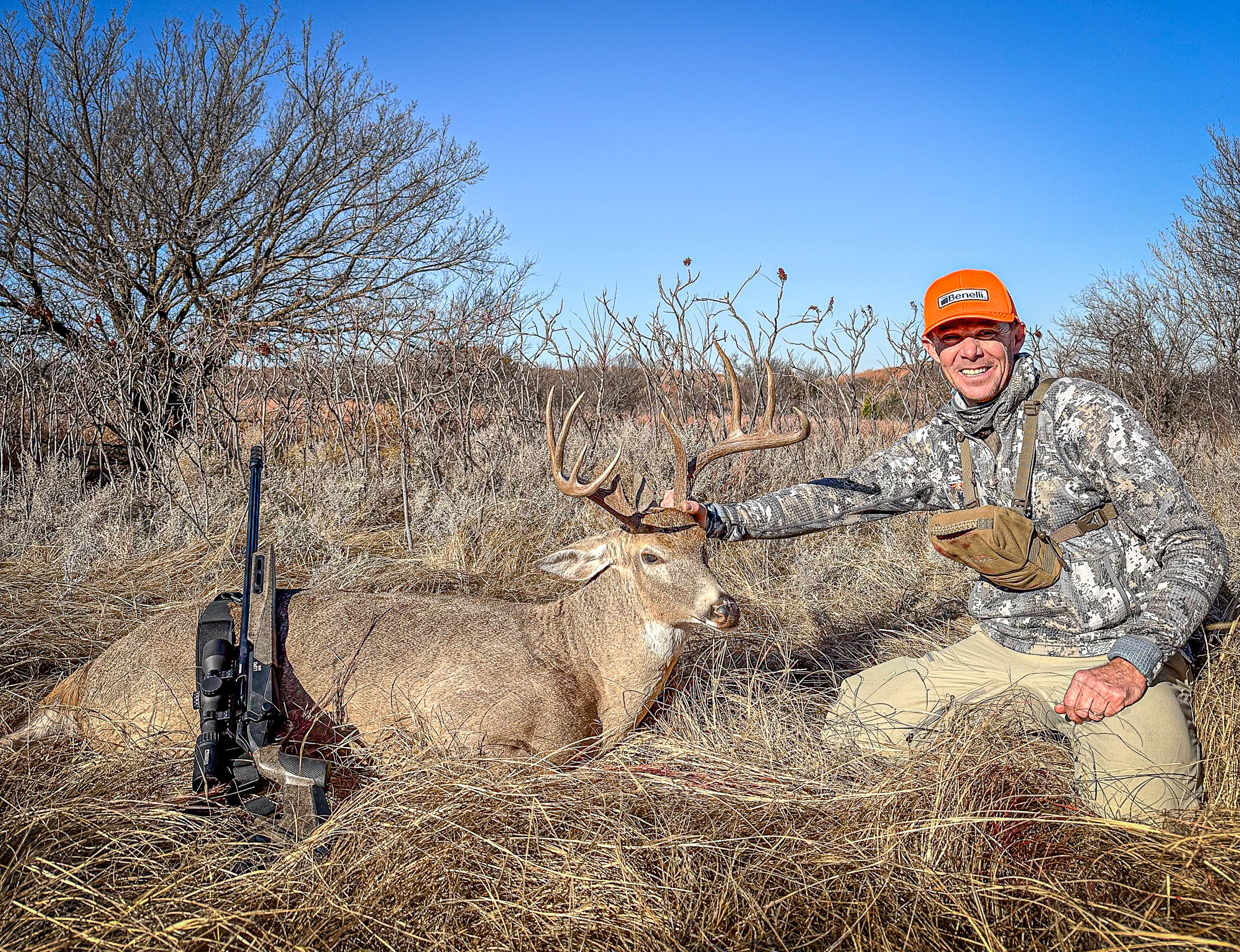 Jace with downed buck and Lupo HPR rifle 