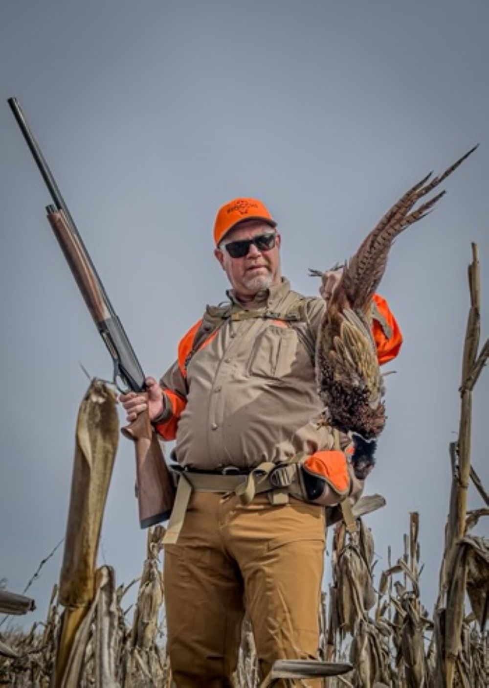 Fenson with a harvested pheasant with a super long tail 