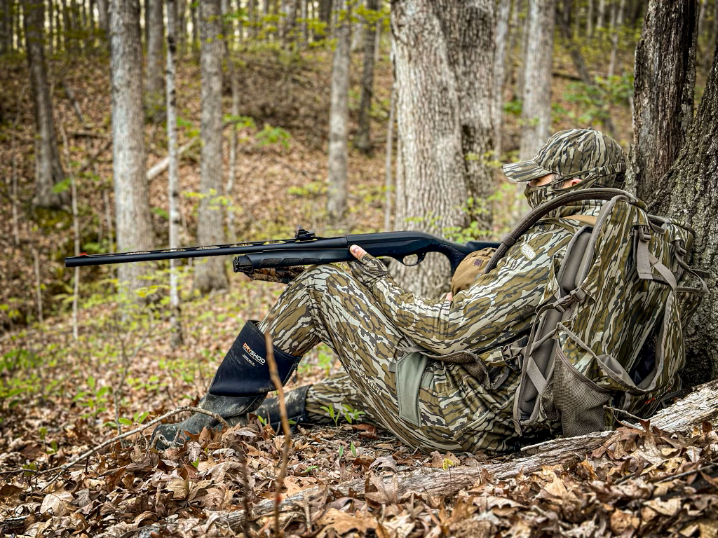 David Kelley sitting in the woods listening for Turkey's 