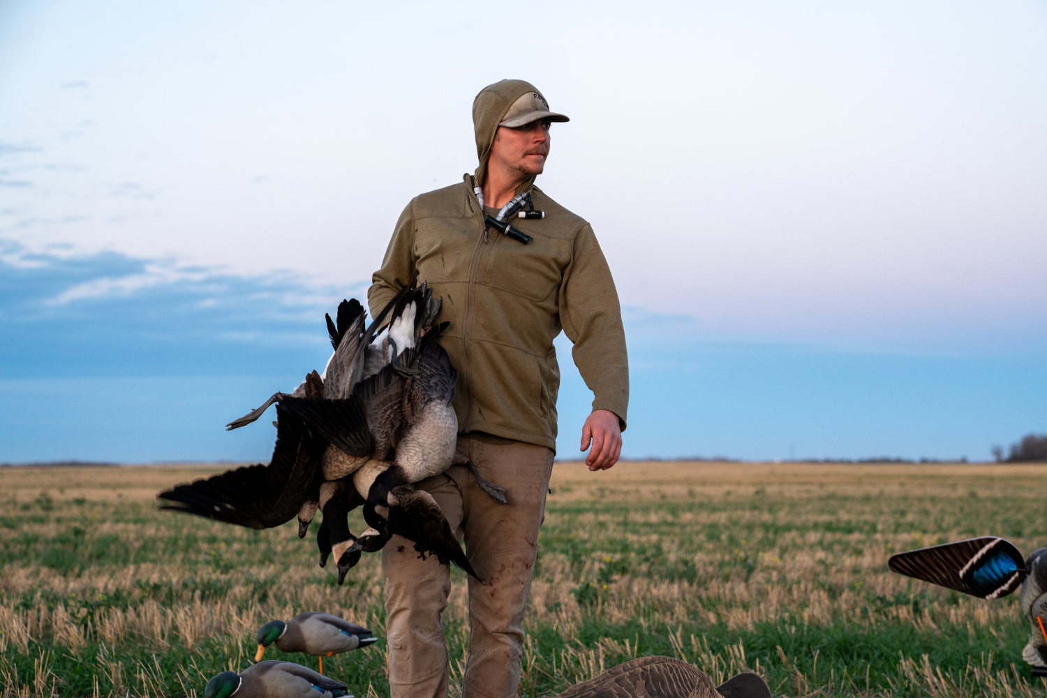 Alberta duck and goose hunting- Hunter with Harvested Geese