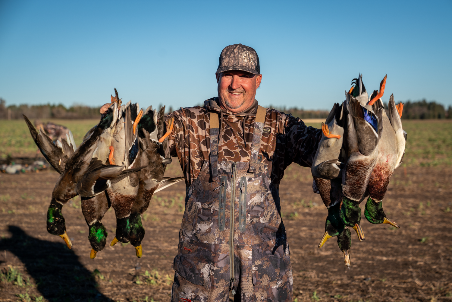 Alberta duck and goose hunting Man With Harvested Ducks