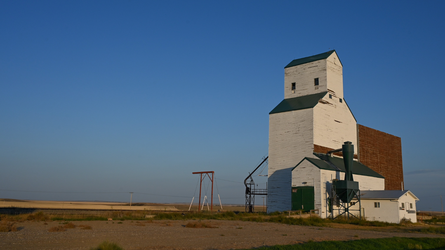 Open field with a barn and clear views for miles
