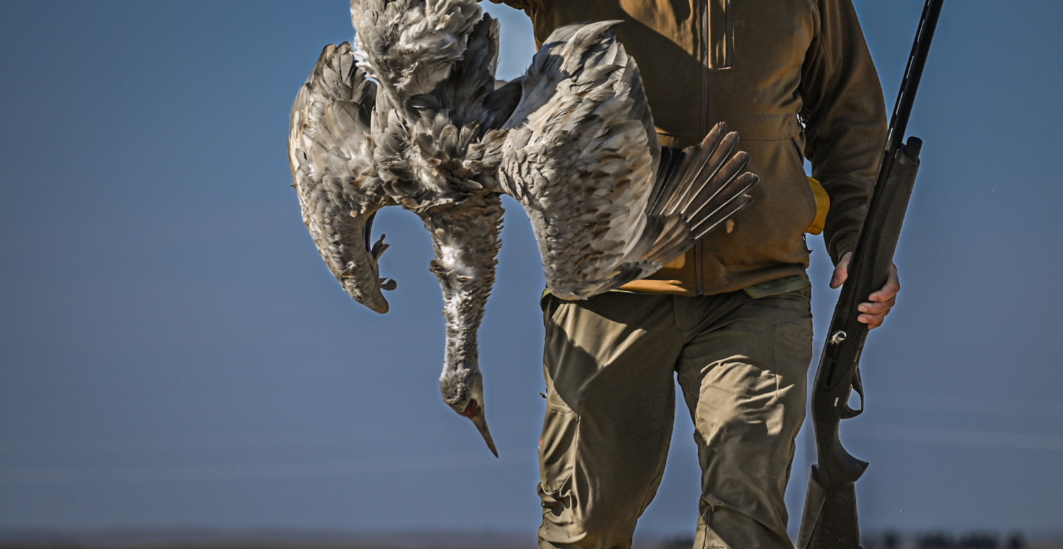 Skip with Benelli Ethos BE.S.T. A.I. shotgun and a downed sandhill crane