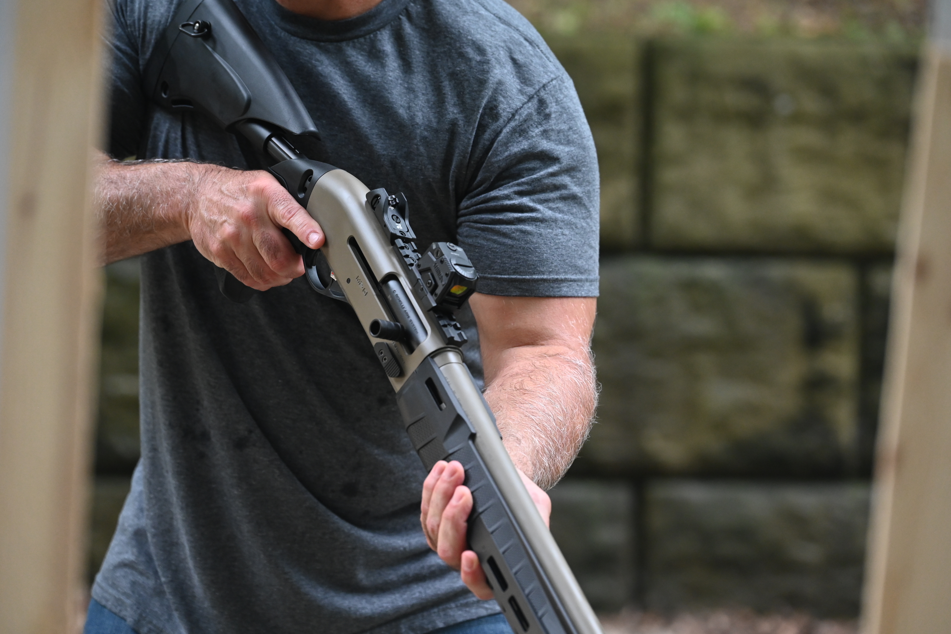 Man at ready stance with the M2-G1 locked and loaded 