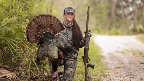 Madison Jones with a SBE3 tukey gun and a harvested turkey