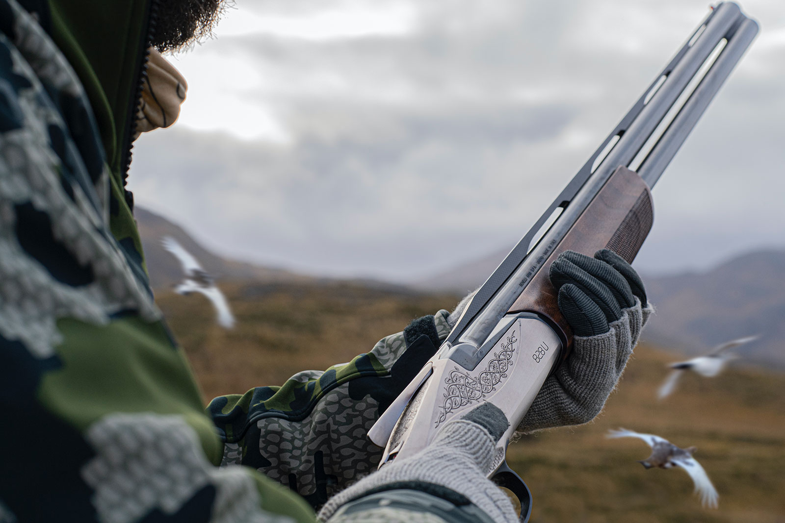 Donnie Vincent in position to shoot with Benelli’s 828 U over under 12-gauge shotgun while hunting ptarmigan in the open fields on Adak Island, Alaska.